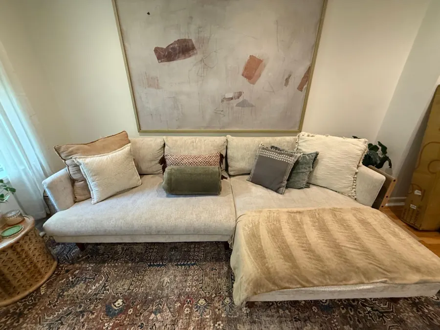 Bright, comfortable living room in a Maryland home kept clean with regular cleaning from TCS Cleaning Service