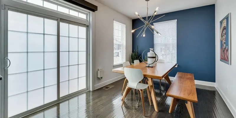 Bright dining area with a wood table, the kind of common space an Airbnb turnover cleaning resets in Maryland