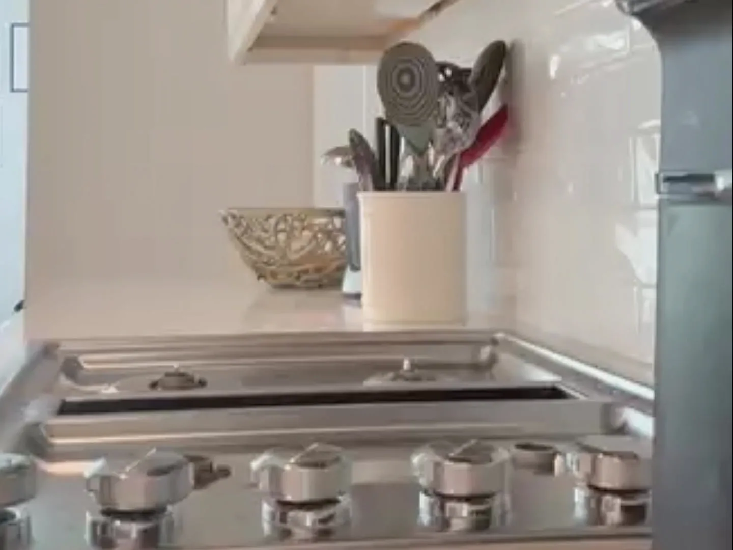 Stainless steel stovetop and backsplash cleaned in detail by TCS Cleaning Service