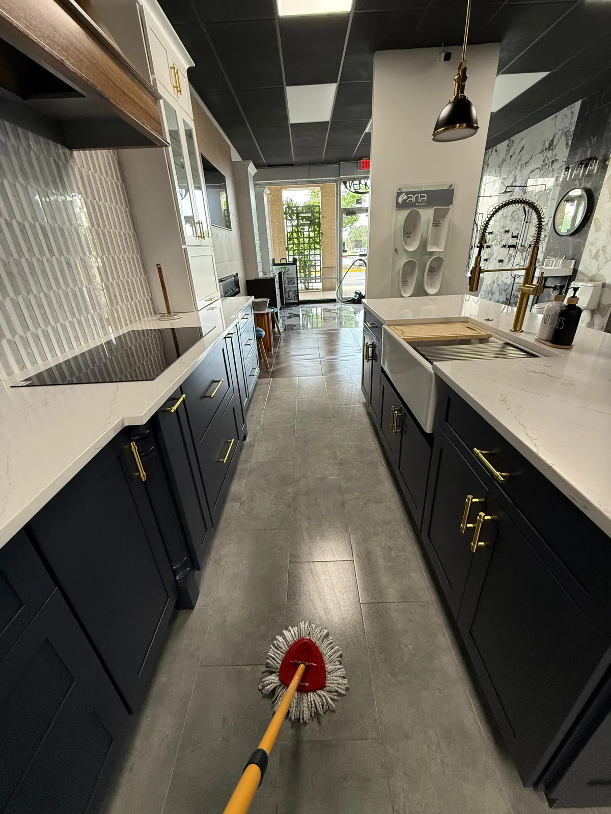 Kitchen floor being mopped during a TCS Cleaning Service visit