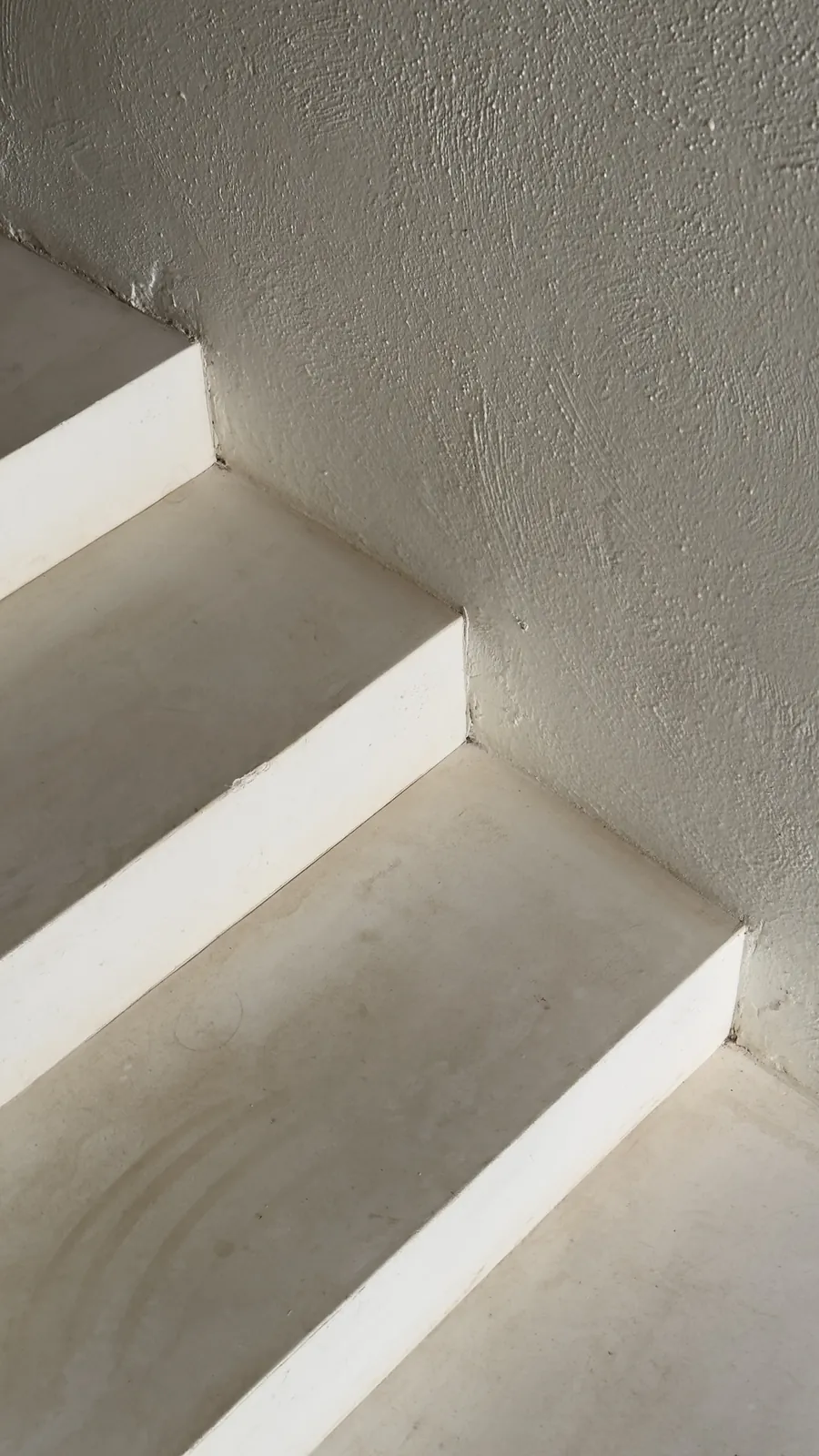 Dust-free stair edge and wall after a detailed cleaning by TCS Cleaning Service