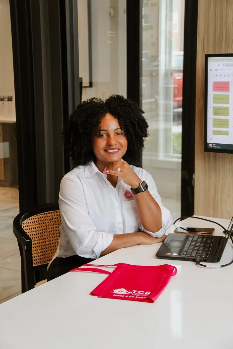 Tati de Souza, founder of TCS Cleaning Service, at her desk in Frederick, Maryland