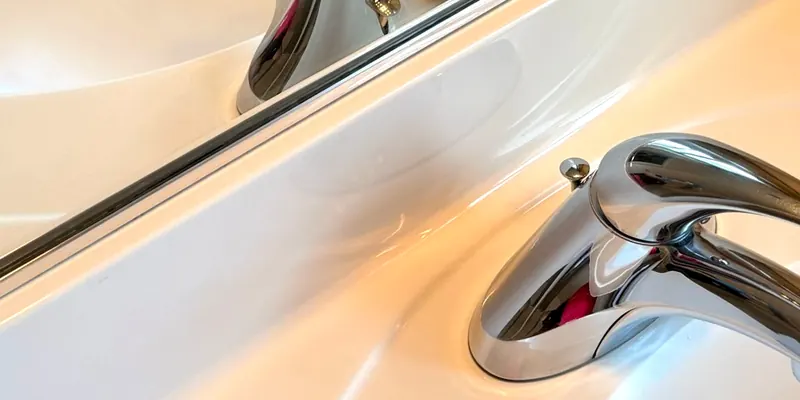 Polished chrome faucet and spotless bathroom sink